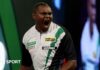 PDC World Darts Championship 2026: David Munyua stuns world number 18 Mike de Decker in first round David Munyua celebrates beating Mike de Decker