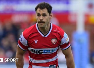Tomos Williams: Gloucester confirm exit of Wales scrum-half Tomos Williams standing on the pitch during a match for Gloucester