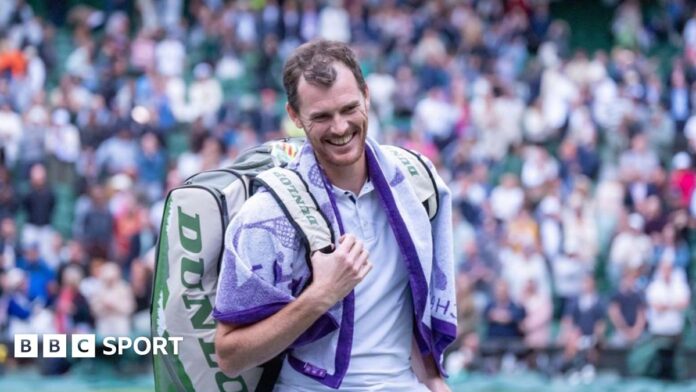 Jamie and Andy Murray touch hands