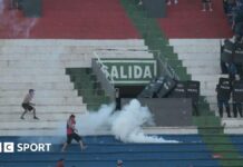 Paraguay derby abandoned as police fire rubber bullets and tear gas amid violent clashes Police fire tear gas in an attempt to quell trouble during a game between Olimpia and Cerro Porteno in the Paraguay captial Asuncion.