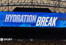 World Cup 2026: Gianni Infantino says hydration breaks bring no extra revenue for Fifa’ Television screen inside a stadium shows the words "hydration break" at the World Cup