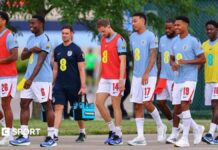 World Cup 2026: Ivan Toney scores hat-trick in England friendly win England players head to the pitch to warm up before a friendly against Sporting Kansas City