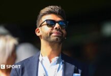 Liverpool: FSG in talks to sell minority stake to Amit Bhatia consortium Amit Bhatia looks on from the Loftus Road directors' box during a Championship match
