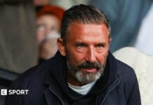 McInnes gets touchline ban for ‘disgusting’ Celtic penalty remark Jeff Bezos and Liverpool FC badge
