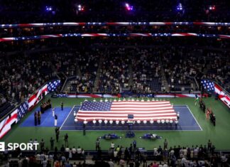 9/11 anniversary: US Open commemorates 25-year anniversary of attacks on New York A giant flag is unfurled on the Arthur Ashe Stadium on the 25th anniversary of the 9/11 attacks